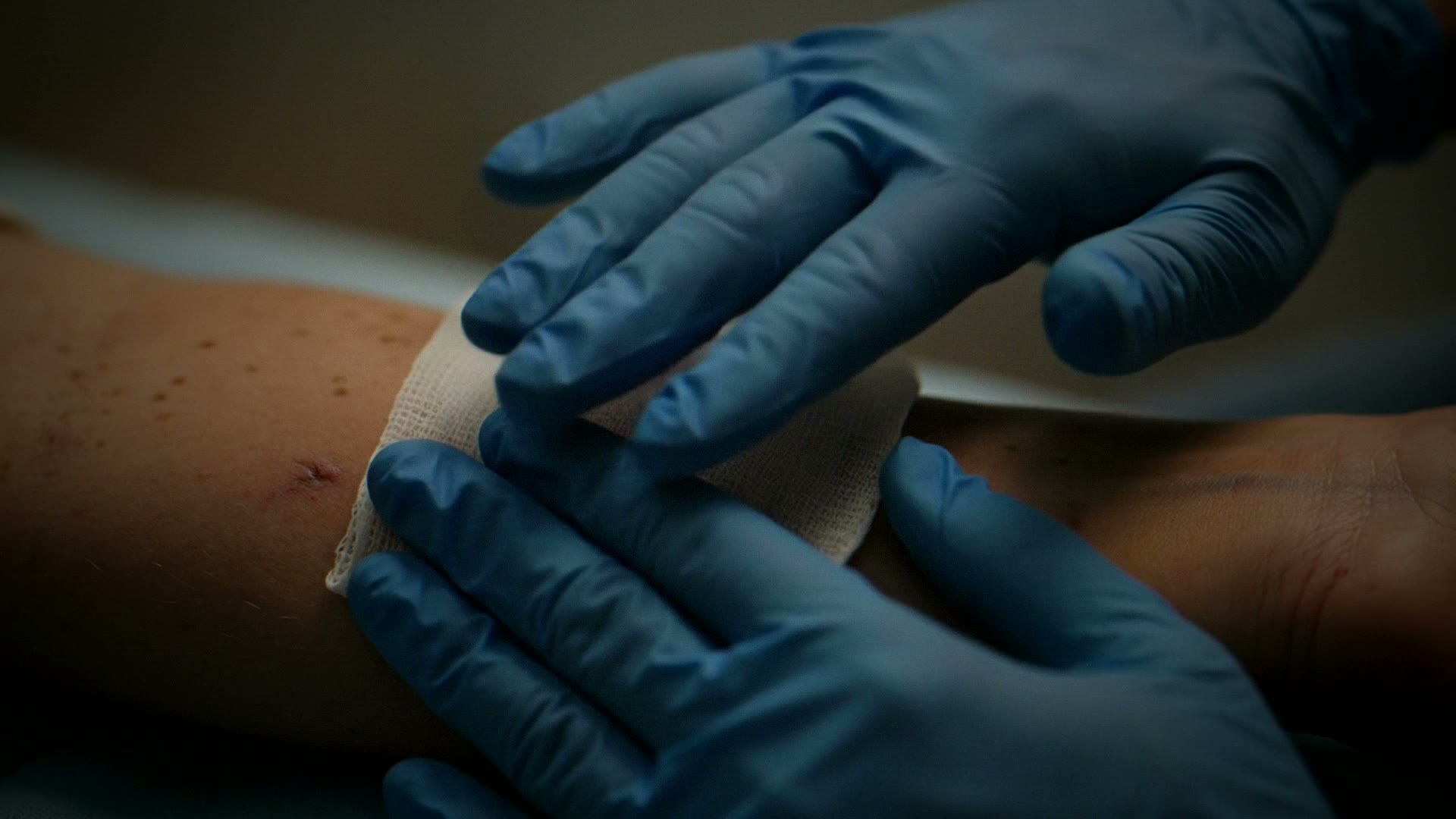 Slow, calm footage inside a wound care clinic: clean dressings and supplies in warm natural window light, no faces.
